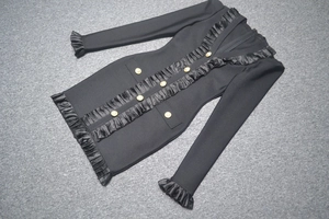 Detailed view of black mini bandage dress with gold buttons and elegant ruffle trim