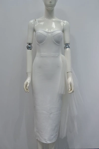 Detail of white strapless bodycon dress featuring layered tulle side draping and corset bodice