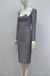 Detail view of grey bodycon dress featuring a unique heart-shaped neckline and ribbed chest folds