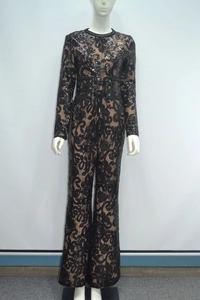 Detail of black lace jumpsuit with shimmering sequins and adjustable eyelet waist belt
