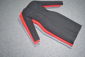 Close-up of three long-sleeved bodycon dresses in black, red, and gray with hidden back zippers