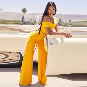 Chic bright yellow two-piece set featuring V-neck cropped top and high-waist wide-leg pants