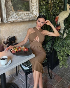 Close-up of brown cross halter neck dress with cutout detail and bandage rib fabric