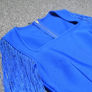 Detail of royal blue bandage dress with square neck and long fringe ornaments