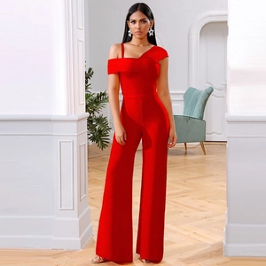 Detailed view of the red bandage fabric and high-waisted wide-leg trousers ensemble
