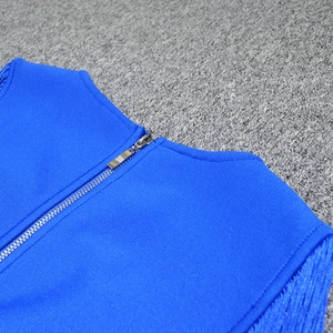Close-up of bright blue bandage dress featuring high-density knit fabric and silver metal zipper