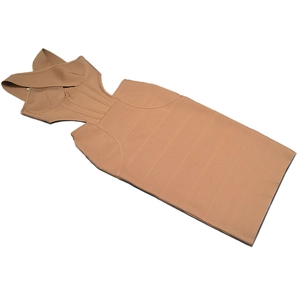 Detail of light brown bandage dress featuring criss-cross halter and waist cutouts