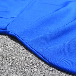 Close-up detail of electric blue bandage fabric with professional stitching and texture
