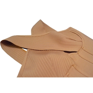 Close-up of khaki bandage dress showing crisscross ribbed fabric and high-quality stitching