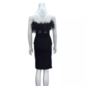 Elegant black feather bandage dress with white lace side detail from the back view