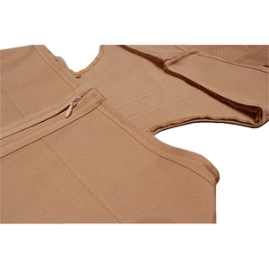 Macro detail of camel bandage dress showing ribbed fabric, cutout and invisible zipper