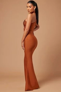 Detailed back view of a slim-fit orange-brown bandage evening dress with fishtail hem