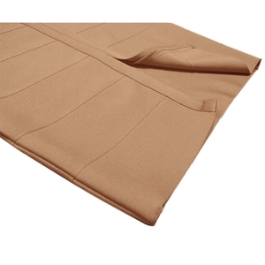 Macro detail of the brown ribbed knit fabric showing texture and elastic material