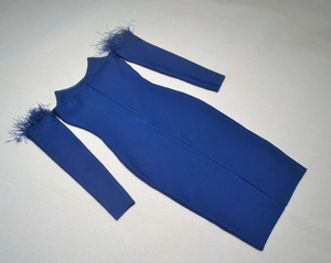 Detail of royal blue bandage dress featuring elegant feather trim on long sleeves