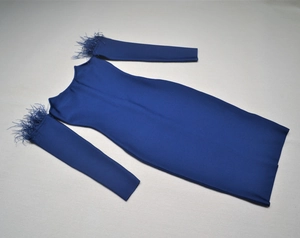 Detail of off-the-shoulder royal blue bandage dress featuring elegant feather cuffs