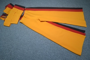 Flat lay of high waisted color block wide leg pants and sleeveless crop top set