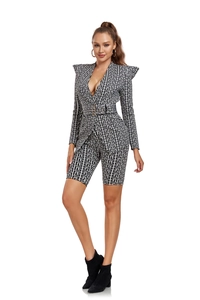 Detail of black and white geometric maze pattern on long sleeve blazer and shorts set