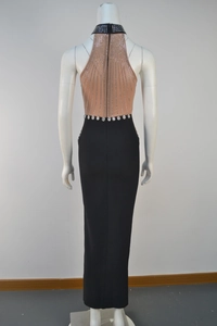 Detail of the sheer mesh back with sparkling rhinestones on an elegant evening gown