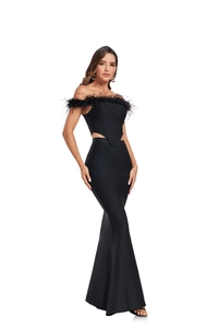 Detail of elegant black off-shoulder corset dress with ostrich feather trim and fishtail skirt