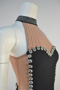 Detail of sheer mesh mesh dress with sparkling silver rhinestones and crystal embellishments