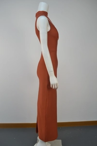Detail of high neck orange-red evening dress with intricate tone-on-tone beadwork