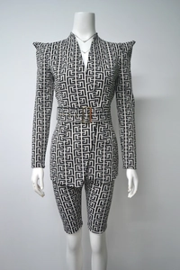 Detail of jacquard blazer and shorts set with labyrinth pattern and gold buckle belt