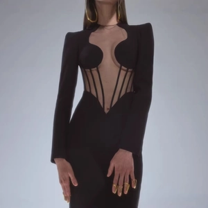 Elegant black long sleeve mesh dress with sheer panels and structured padded shoulders