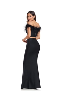 Detail of ostrich feather neckline and metallic zipper on black two-piece bandage set