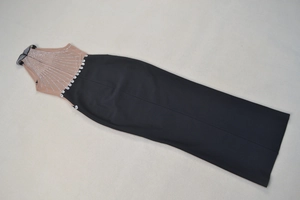 Close-up of mesh top with silver rhinestones and waist crystals on a maxi dress