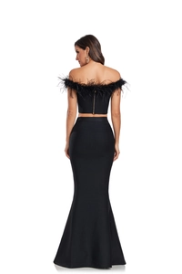 Detail of black off-shoulder bandage top with ostrich feathers and gold back zipper