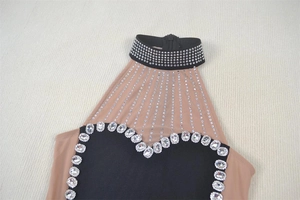 Detail of high neck halter dress with nude mesh patchwork and sparkling rhinestone trim