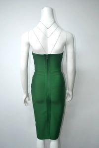 Detail view of the back concealed zipper and green bandage fabric on this bodycon dress
