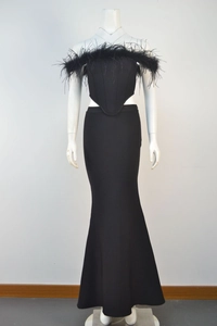 Detail of elegant black off-shoulder mermaid dress with luxury ostrich feather neckline