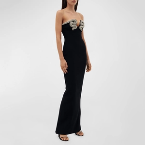Detail of silver rhinestone snake embroidery on the chest of a black tube bandage dress
