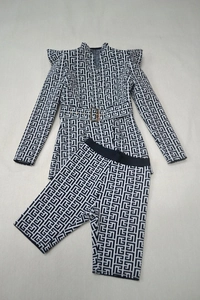 Detail showing jacquard maze pattern on belted blazer and matching shorts set