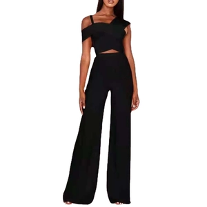 Sexy black two-piece set featuring asymmetrical one-shoulder crop top and high waist wide leg pants
