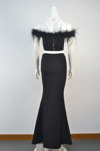 Back view detail of black evening set with feather off-shoulder top and fisheye skirt