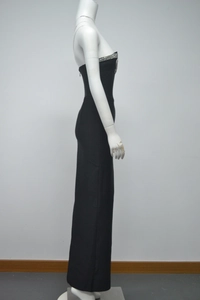 Detail shot of black bodycon evening dress with crystal rhinestones on the tube neckline