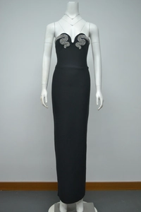 Detail of sweetheart neckline on a black evening gown with silver rhinestone accents