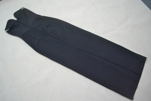 Close-up of black strapless evening gown featuring a heart-shaped neckline with subtle rhinestones