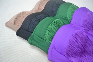 Detail of four-color bandage dress with dense fringe tassels in nude black green and purple