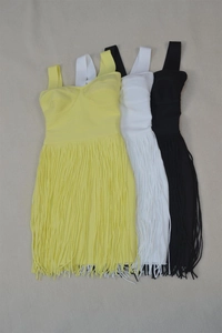 Detailed flat lay of bandage dresses with long fringe tassels in yellow, white, and black
