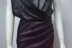 Detail of black satin midi dress featuring a sheer corset bodice and ruched waist design