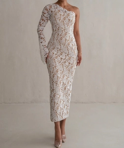 Detailed view of white floral lace texture and one-shoulder sleeve on long evening dress
