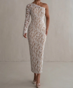 Detail of elegant white one-shoulder lace dress featuring floral embroidery and slim fit design