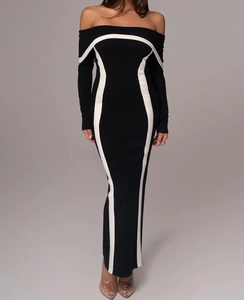 Détail des coutures contrastées noir et blanc sur cette robe moulante longue et élégante
