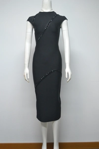 Detail of slim fit black bandage dress featuring elegant black sequin stripe accents