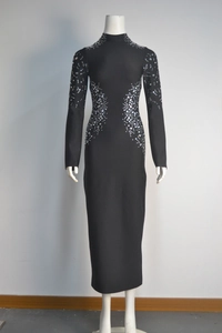 Detailed view of black bandage dress featuring silver rhinestones on sleeves and waist