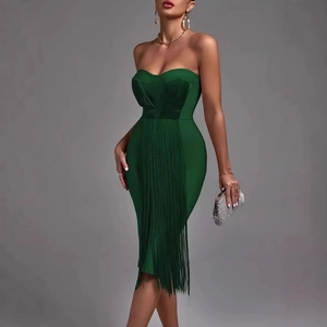 Elegant emerald green strapless bandage dress with layered fringe and slim fit silhouette