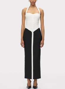 Detail of elegant halter neck maxi dress featuring black and white contrast bandage fabric